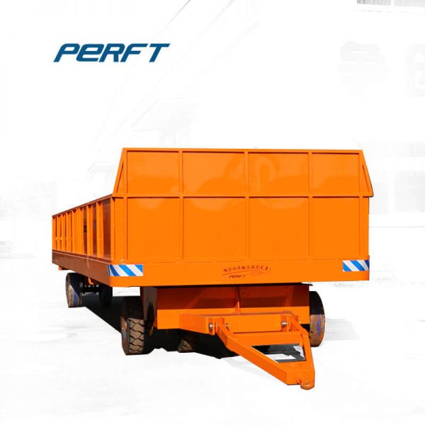 Battery Four Wheels Steering Transport Trolley for Cargo Carriage